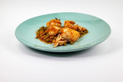 second course with cuttlefish and tomato peas on a white background