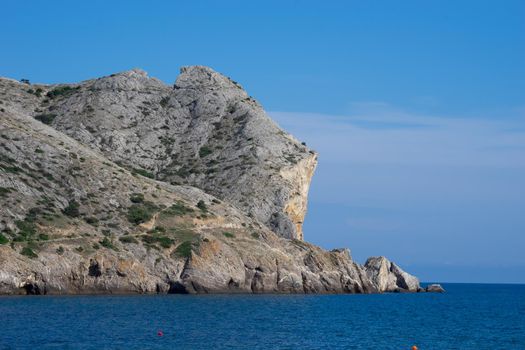 Seascape with a mountain by the sea. Sudak, Crimea