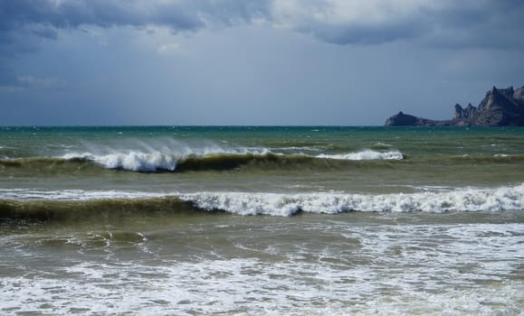 Marine landscape with a beautiful emerald waves. Sudak, Crimea.
