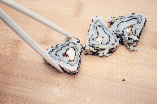 sushi chopsticks restaurant wood cutting board. High quality photo