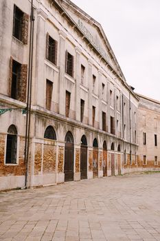 A deserted street in Venice, Italy. The facade of the Venice State Archives building is Archivio di Stato di Venezia.