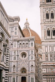 A close-up of the facade of the Santa Maria del Fiore building in Florence, Italy.