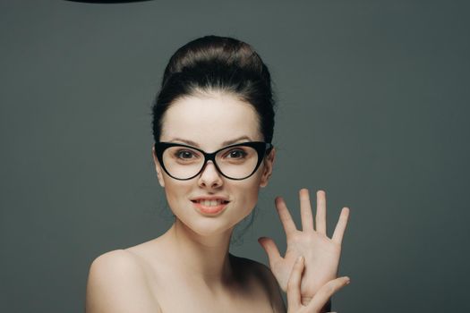 woman with bare shoulders smile clear skin model. High quality photo