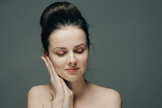 portrait of a beautiful lady with clean skin cosmetology naked shoulders closed eyes. High quality photo