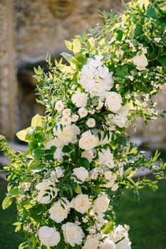 White flowers in the wedding arch, close-up.