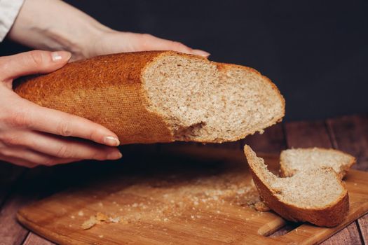 sliced fresh loaf cutting board wooden table. High quality photo