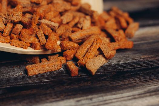 croutons on a plate snacks snack wooden table. High quality photo