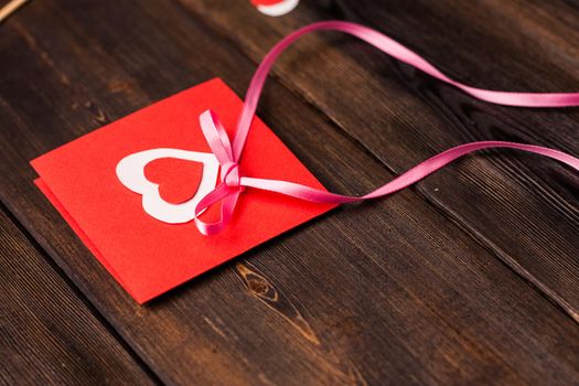 Red card with heart gift holiday love romance. High quality photo
