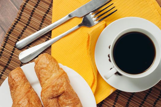 croissants in a plate on the table flour dessert coffee meal. High quality photo