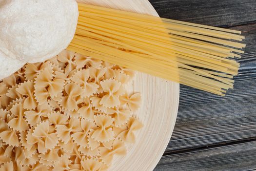 pasta sprinkled on the table tomatoes through italian cuisine cooking. High quality photo