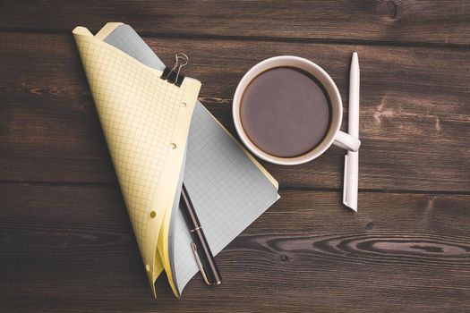 Sheets of paper for writing and a pencil pen clamp wooden table flower in a pot. High quality photo