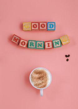 banner of a cup of coffee and inscription Good morning on pink background