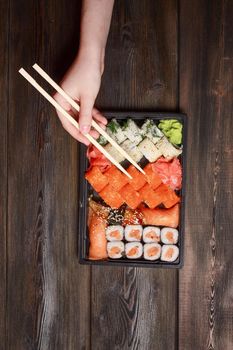 ginger seafood wooden table sushi and rolls delicacy. High quality photo