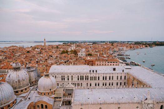 The ferry pier and mooring place for gondolas - San Marco-San Zaccaria, Venice, Italy. Aerial view from huge cathedral bell tower Saint Mark Campanile.