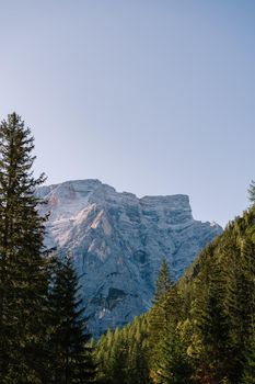 Rocky Mountains with green forests on Lago di Braies. Braies lake in the Dolomites in South Tyrol, Italy, Briesmunicipality Municipality, in the Valley of Prague.