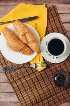 fresh croissants on the table breakfast for dessert close-up. High quality photo