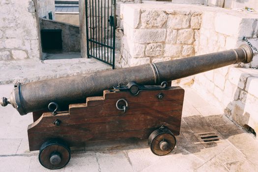 An ancient cannon with kernels on the wall of the old town of Dubrovnik in Croatia