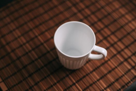 white mug on the table indoors stand texture top view. High quality photo