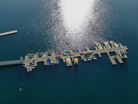 Aerial view of Miramar Lake small pier with pedal boat, small motor boat. Lake with popular activities including boating, fishing, San Diego, California, USA