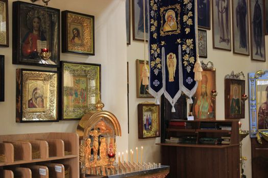 Christian faith. Decoration of the Orthodox church, candles and icons