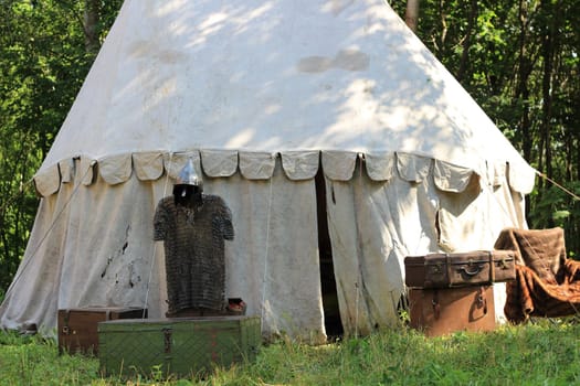 The tent for rest in the forest is round. High quality photo