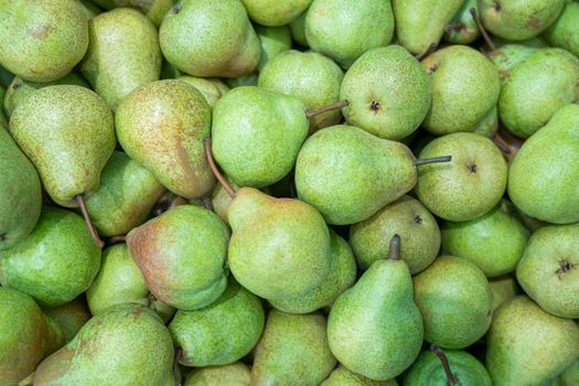 ripe pears close up on the shelves of supermarket stores. High quality photo