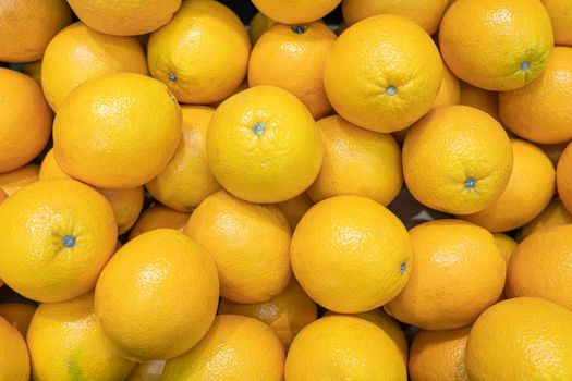 ripe oranges close up on the shelves of supermarket stores. High quality photo