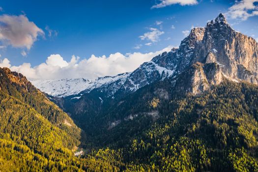 Aerial view of improbable peak of mountains, Italian Alps, green slopes of the mountains, Bolzano, Dolomites