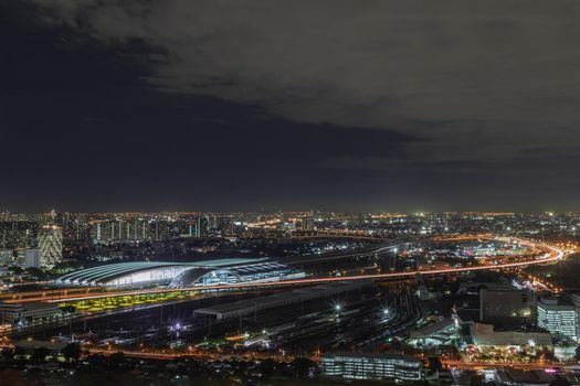 Bangkok, thailand - Aug 28, 2020 : Aerial view of Bang Sue central station with skyscrapers background at night. Selective focus.