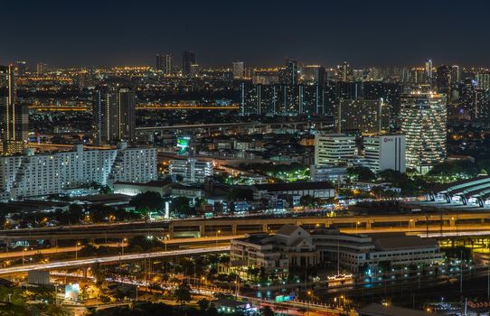 Bangkok, thailand - Aug 28, 2020 : Aerial view of Bang Sue central station with skyscrapers background at night. Selective focus.
