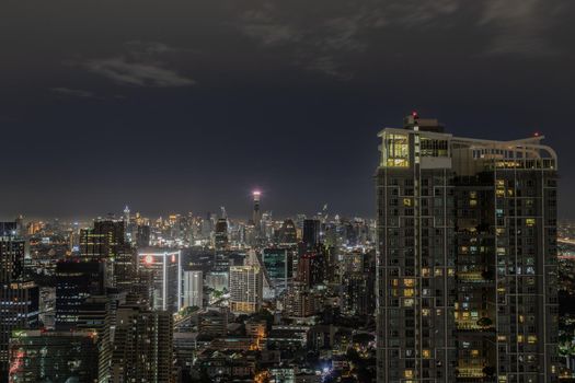 Bangkok, thailand - Aug 28, 2020 : Bangkok downtown cityscape with skyscrapers at night give the city a modern style. Selective focus.