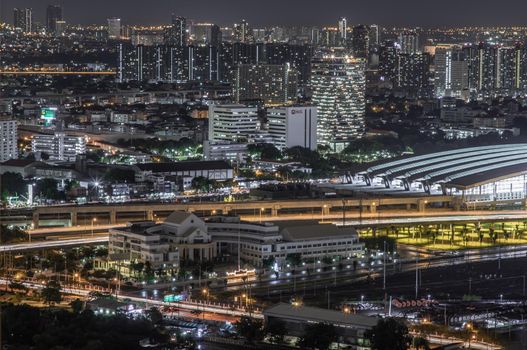 Bangkok, thailand - Aug 28, 2020 : Aerial view of Bang Sue central station with skyscrapers background at night. Selective focus.