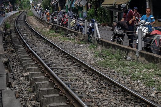 Bangkok, Thailand - July 10, 2019 : Railway tracks adjacent to the community. Transportation and travel concept. Focus and blur.