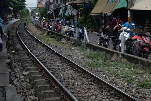 Bangkok, Thailand - July 10, 2019 : Railway tracks adjacent to the community. Transportation and travel concept. No focus, specifically.