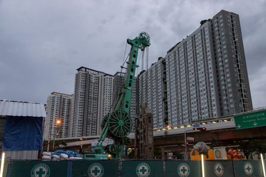 Bangkok, Thailand - 27 Sep 2020 : Construction, repair of a road in a residential area of the city. Road construction machinery at the construction site of a new road. No focus, specifically.