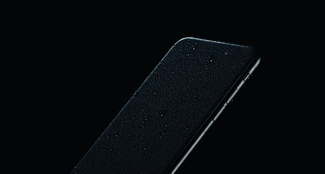 touchscreen mobile phone new technology touch on dark background. High quality photo