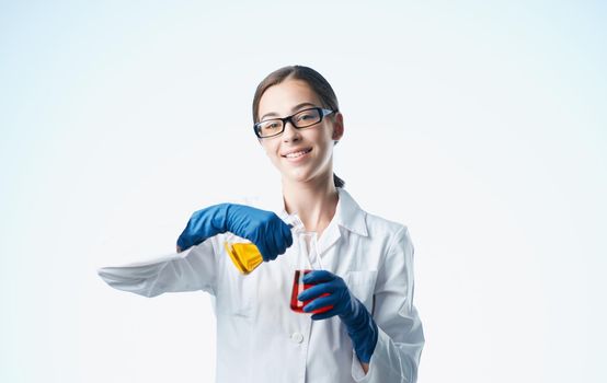 woman doctor professional with vaccine flasks in hand analyzes. High quality photo