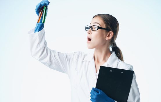 woman doctor with virus vaccine laboratory analyzes chemical element glasses gloves model. High quality photo