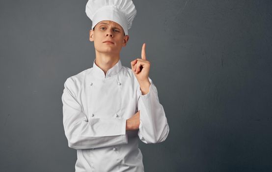 male chef cooking food hand gestures restaurant food preparation service. High quality photo