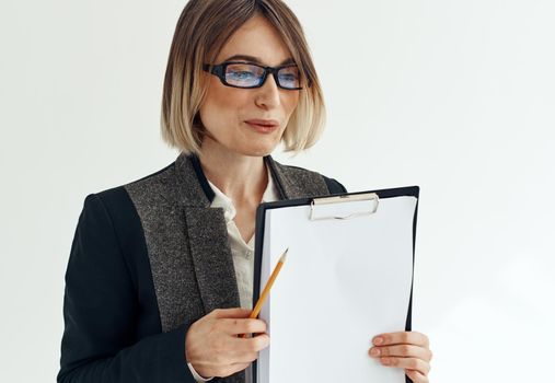 Charming lady with documents in her hands white sheet of mockup paper. High quality photo