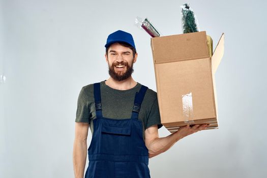 man in working uniform boxes delivery loading service. High quality photo