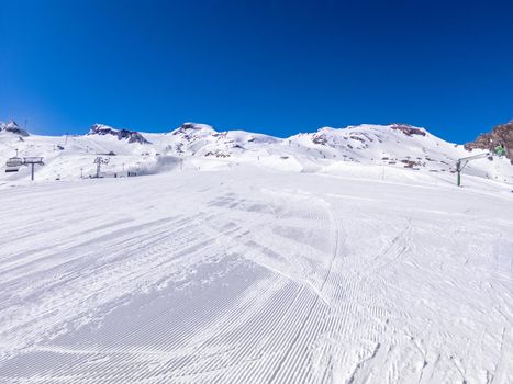 winter skiing area on a glacier with a ski slope.
