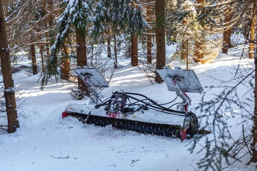 snow plow in the winter snowy forest.