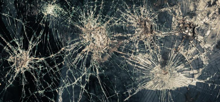 Abstract image of broken glass texture. Close-up broken car windshield. Broken and damaged car