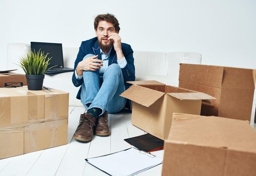 Business man emotions boxes with lifestyle things unpacking. High quality photo