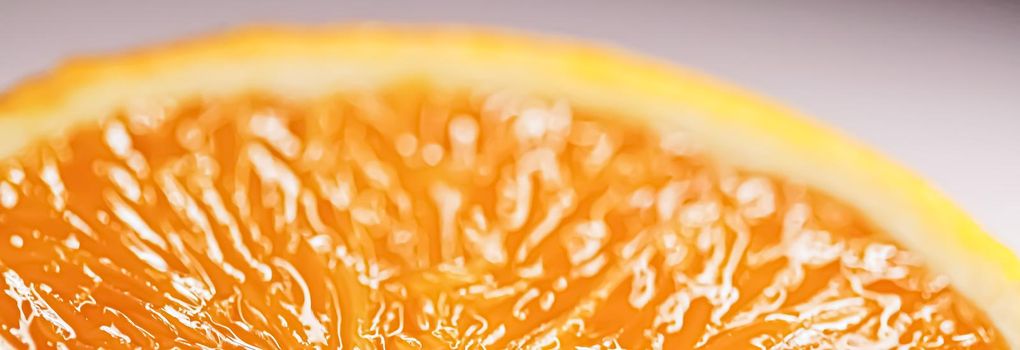 Juicy oranges half cut and sliced, healthy food and fruit closeup