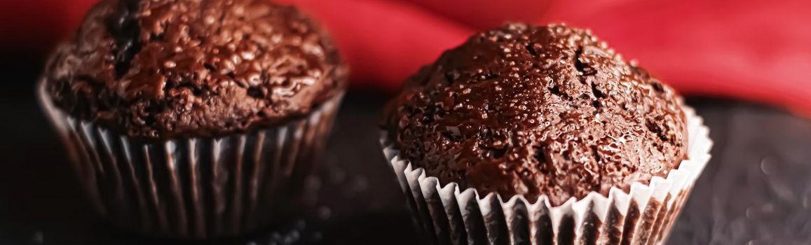 Two chocolate muffins freshly baked at home, homemade comfort food recipe concept