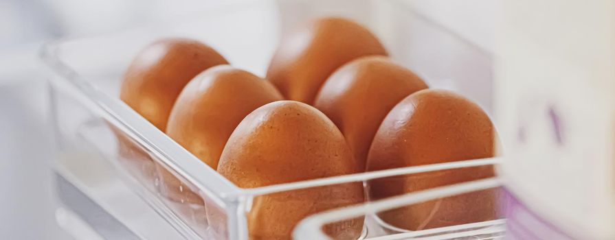 fresh eggs in refrigerator, dairy product closeup