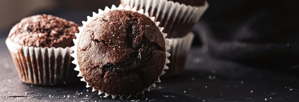 Homemade chocolate muffins, baked comfort food recipe concept