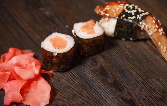 sushi chopsticks rolls snack delicacy japanese cuisine gourmet. High quality photo